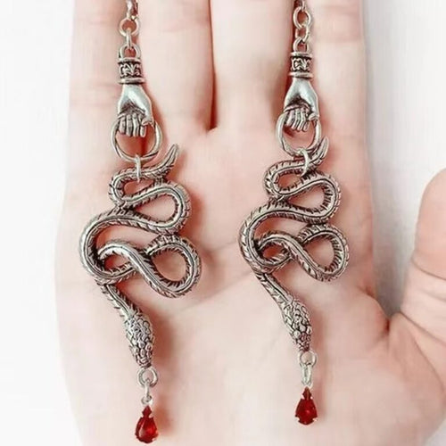 ER-Hand Holding Snake red gem